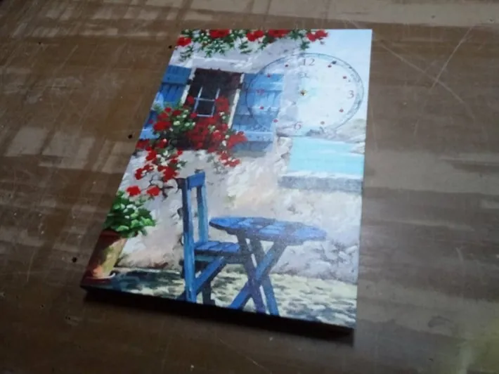 Mavi Sandaye Masa Çiçekli Ev ve Manzaralı Kanvas Tablo